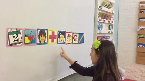 Student using flash cards to speak three languages